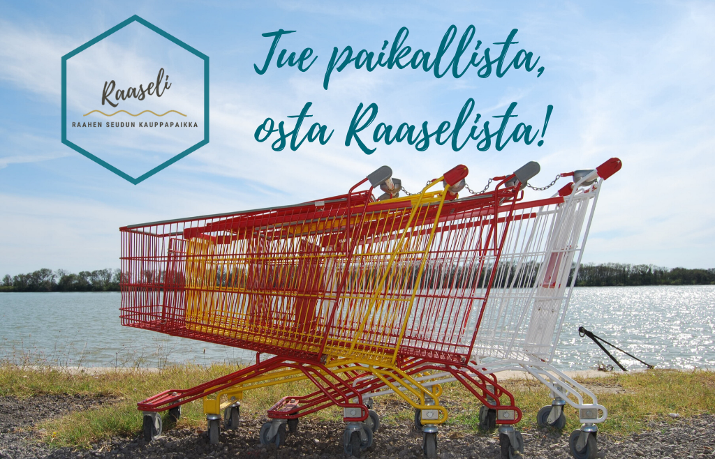 Värikkäitä ostoskärryjä rannalla sekä Raaseli-verkkokaupan slogan, tue paikallista osta Raaselista.