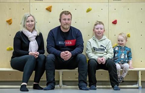 A family photo of the Kyröläinen family of four.